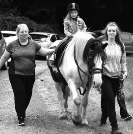 Family enjoying horse ride at Ballymore Strawberry Fayre in 2017.